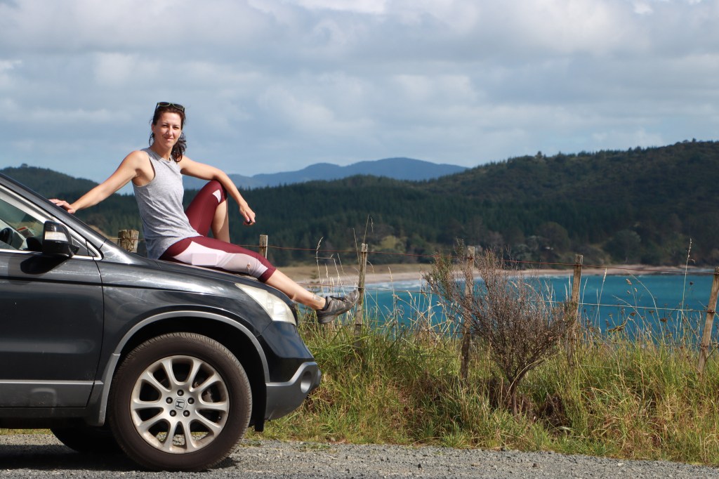 Person posing for thumbnail for travel vlog. 