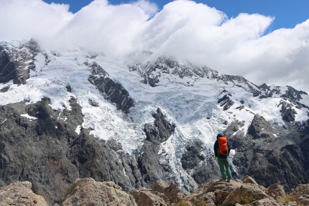 Travel vlogger posing on mountain